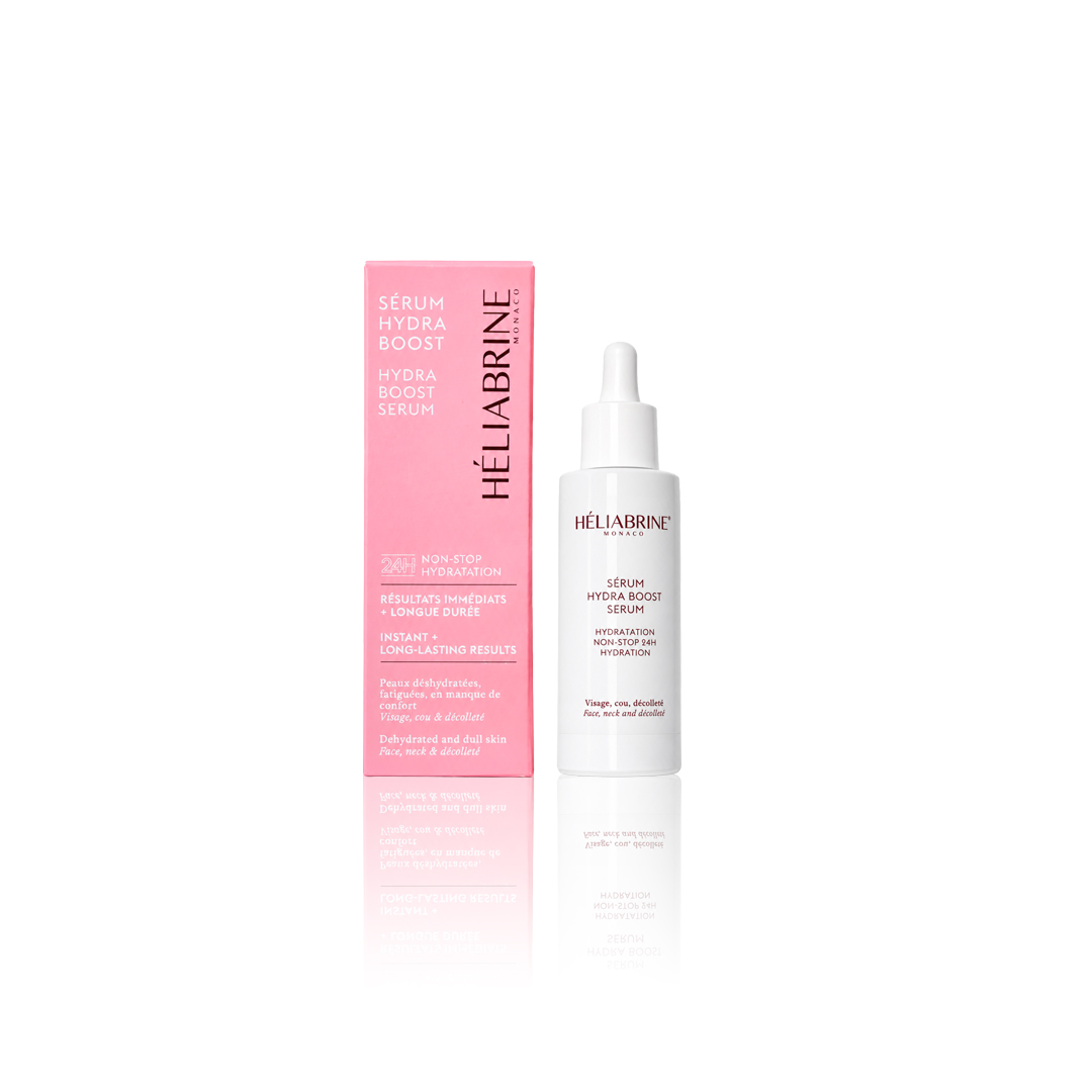 Na sliki sta roza škatlica in bela steklenička. Napis Héliabrine Hydra Boost Serum.